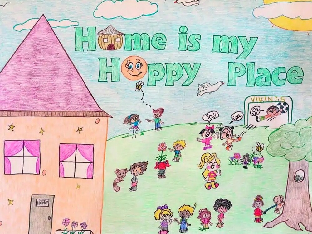 What Home Means to Me Poster Contest Winner, August 2024. Home is my Happy Place. A large group of children inbetween a house and a tree with a squirrel in it playing and happy.